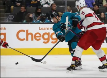  ?? NHAT V. MEYER — BAY AREA NEWS GROUP, FILE ?? The Sharks' Kevin Labanc (62) scores a goal against the Hurricanes' Jordan Staal (11) in the third period at SAP Center in San Jose on Nov. 22.