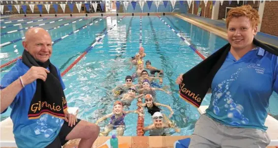  ??  ?? SWIM FUN: Glennie swim coach Jeffrey Davidson and head swim coach Codie Grimsey warm up with squad swimmers. PHOTO: CONTRIBUTE­D