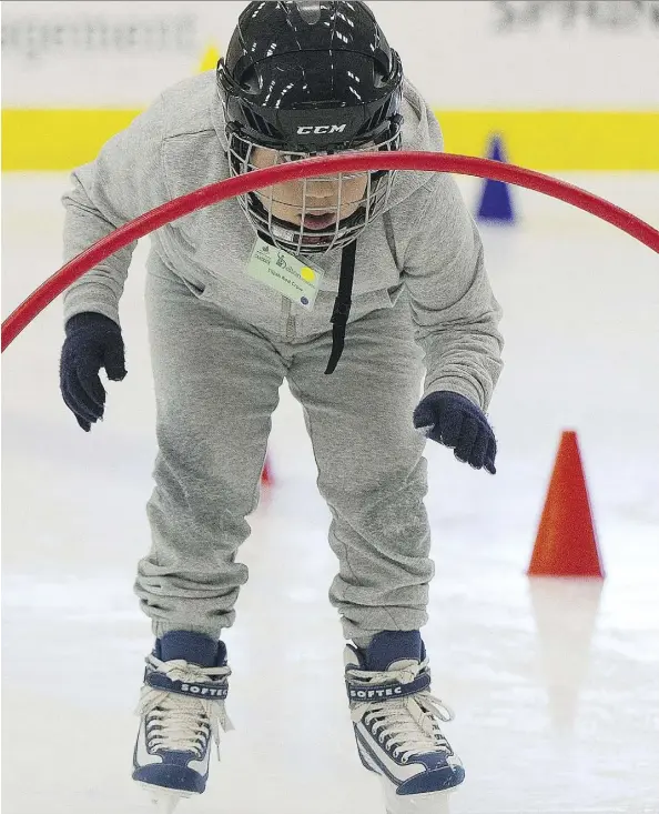  ?? GREG SOUTHAM ?? Elijah Red Crow from Delton School takes part Wednesday in a new community program at the Downtown Community Arena that is preparing elementary-aged students for ice sports and recreation­al skating. The CanSkate@School program is expected to host Grade...