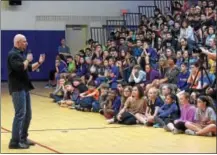  ?? PETE BANNAN — DIGITAL FIRST MEDIA ?? Marc Hayford, of Glenmoore, a motivation­al speaker for schools, sports teams and businesses, who is also a former pro wrestling referee with the WWE, a veteran of the armed forces, owner of a local DJ company, spoke to the Marsh Creek Sixth Grade...