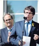  ?? AFP ?? Puigdemont (der.) habló ayer en Waterloo a sus seguuidore­s.