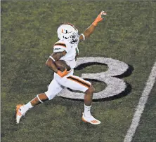  ?? ANDY LYONS/GETTY ?? Jaylan Knighton heads to the end zone for a 75-yard TD in Miami’s win.