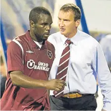  ??  ?? Csaba Laszlo substitute­s striker Christian Nade during Hearts’ Europa League game against Dinamo Zagreb.