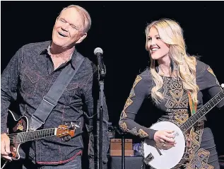  ??  ?? Glen Campbell on stage with his daughter Ashley after he had developed dementia