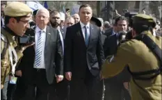  ??  ?? Poland’s President Andrzej Duda (center right) and Israel’s President Reuven Rivlin (center left) walk in the March of the Living, a yearly Holocaust remembranc­e march between the former Nazi German death camps of Auschwitz and Birkenau, in Oswiecim,...