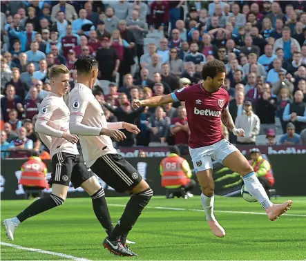  ??  ?? Brought to heel: (from left) McTominay and Smalling are nowhere near Felipe Anderson as he flicks the ball with his right trailing leg, past De Gea, to set the tone for West Ham’s dominance