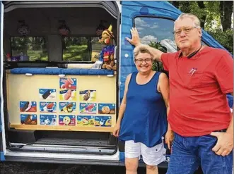  ?? THOMAS GNAU / STAFF ?? Shelly and James “Jimbo” Greenberg sell ice cream from a fleet of vans — and business has been good, the Greenbergs say. On a recent afternoon, they were in the neighborho­od around Steam Academy of Dayton. “We’ve been here for over 20 years,” he says.