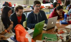  ?? PHOTO PROVIDED ?? Students participat­e in a past RPI Hackathon.