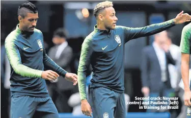  ??  ?? Second crack: Neymar (centre) and Paulinho (left)
in training for Brazil