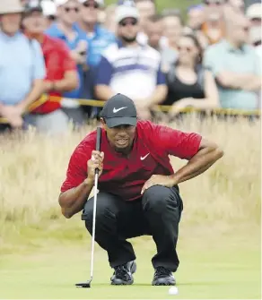  ?? PETER MORRISON/AP ?? Tiger Woods had the lead at one point during the final round of the British Open Sunday but in what has become a familiar scenario in recent times, he faltered down the stretch.