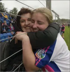  ??  ?? Jackie and Ciara Patrick embrace after the final whistle.