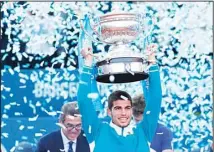  ?? ?? Spain’s Carlos Alcaraz holds a trophy as he celebrates after winning the ATP Godo Tournament final tennis match against Spain’s Pablo Carreno Busta, in Barcelona, Spain. (AP)