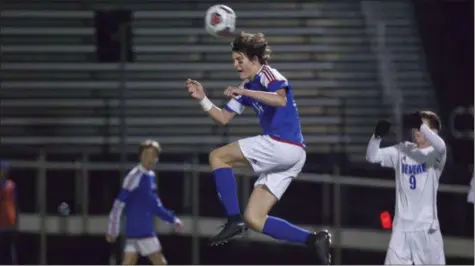  ?? JEN FORBUS — FOR THE MORNING JOURNAL ?? Bay’s Cade Gergye makes a leaping header during the Rockets’ state semifinal against Revere.