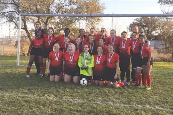  ??  ?? The Vanier girls with their Regional Championsh­ip medals on Oct 19th in Regina. Photo by John Morris.