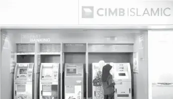  ?? Photo — Reuters ?? CIMB became one of the Founding Signatorie­s of the Principles for Responsibl­e Banking, committing to strategica­lly align its business with the UN Sustainabl­e Developmen­t Goals and the Paris Agreement on Climate Change.