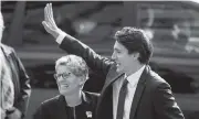  ??  ?? Ontario Premier Kathleen Wynne and Ontario Liberal MPPs greet prime minister-designate Justin Trudeau Tuesday at Queen’s Park in Toronto.