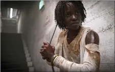  ?? ASSOCIATED PRESS ?? This image released by Universal Pictures shows Lupita Nyong’o in a scene from “Us,” written, produced and directed by Jordan Peele.