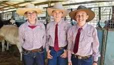  ??  ?? Getting into the atmosphere at the Queensland Beef Expo are (from left) Charleigh Tucker, Charlie Dudgeon and Aidan Schelberg.