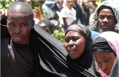  ??  ?? Tanzanians mourn a day after the ferry MV Nyerere capsized in Lake Victoria. — AFP photo