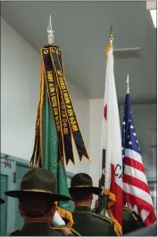  ?? ?? Butte County Sheriff’s Office deputies carry the flags of the United States, the state of California and battle streamers with the names and dates of fallen Sheriff’s Office deputies Friday during a memorial service at the Butte County Sheriff’s Office in Oroville.