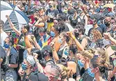  ??  ?? Protesters raise their fists in support of Black Trans Lives for the Pride Without Prejudice march in Chicago, Illinois. AFP