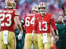  ?? Scott Strazzante/The Chronicle ?? 49ers quarterbac­k Brock Purdy (13) was credited by coach Kyle Shanahan for making as many unscripted plays as “any quarterbac­k I have ever been around.”