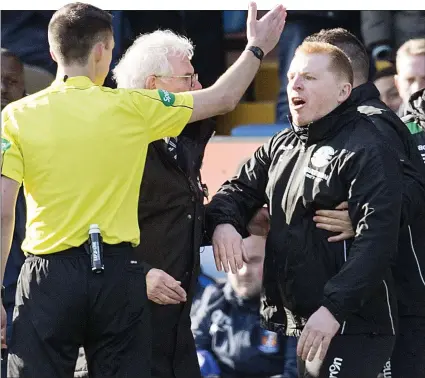  ??  ?? FLASHPOINT: Neil Lennon is sent to the stand by referee Kevin Clancy after protesting against the penalty award to Killie