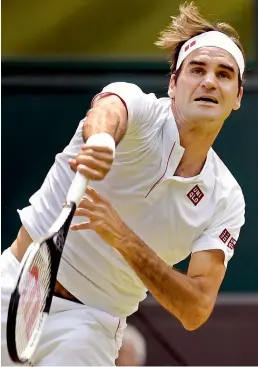  ?? — AFP ?? Switzerlan­d’s Roger Federer returns to Adrian Mannarino of France in their Wimbledon fourth round match in London on Monday. Federer won 6-0, 7-5, 6-4.