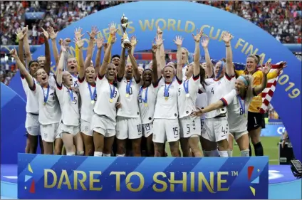  ?? ALESSANDRA TARANTINO — THE ASSOCIATED PRESS FILE ?? The United States celebrates with the trophy after winning the Women’s World Cup final this year in France.