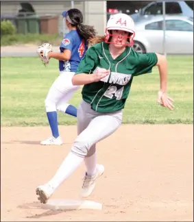  ?? MIKE BUSH/NEWS-SENTINEL ?? Liberty Ranch base runner Presli Kooyman touches second base en route to third in the bottom of the third inning of Wednesday's Sac-Joaquin Section Division IV softball playoff game against Kimball.