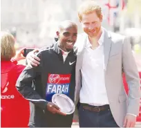  ?? Associated Press ?? Mo Farah (left) poses for a photo with Prince Harry after finishing third in the Men’s race in the London Marathon in central London, on Sunday.