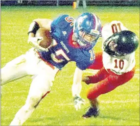  ?? PHOTO BY RICK PECK ?? McDonald County’s Jack Bowers brings down East Newton’s Brett Pendergraf­t during the Patriots 56-34 win Friday night at East Newton High School.