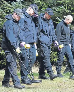  ?? Pictures: PA. ?? Police carrying out forensic searches at a wooded area near Biggar as they look for clues in an effort to solve the murder of Emma Caldwell, right.