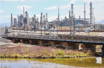  ?? HYOUNG CHANG/THE DENVER POST ?? A Suncor oil refinery in Commerce City, Colorado, in April. President Joe Biden on Wednesday called on U.S. oil refiners to produce more gasoline and diesel.