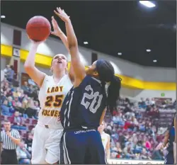  ?? The Sentinel-Record/Grace Brown ?? HAVE MERCY: Lake Hamilton senior forward Baylee Barton (25) goes for the basket against J.A. Fair sophomore Nariah Samuels (20) Friday during the Lady Wolves’ 61-38 home victory at Wolf Arena in Pearcy.