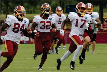  ?? AP FILE PHOTO BY STEVE HELBER ?? In this Aug. 5, 2019, file photo, Washington Redskins wide receiver Terry Mclaurin (17) runs drills with teammates Samaje Perine (32) and Darlin Kidsy Jr., (84) during the Washington Redskins NFL football training camp in Richmond, Va. The Redskins will become the first NFL team to have a gambling-focused telecast of their games, offering cash prizes to viewers who correctly predict in-game outcomes during the preseason. The telecasts on the regional cable network NBC Sports Washington will follow a formula establishe­d by the Redskins’ NBA neighbors, the Washington Wizards.