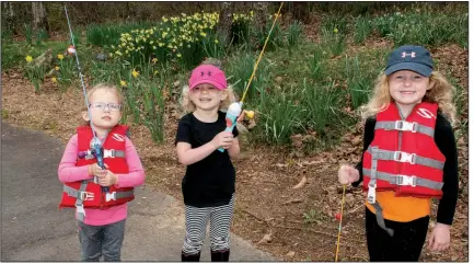  ??  ?? Cousins Chase Campbell, Campbell Grace Appleberry and Reese Campbell on their way to fish in the park’s lake