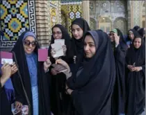  ?? MAJID SAEEDI, GETTY IMAGES ?? Iranians vote in the city of Qom, Iran, south of the capital, Tehran, Friday.