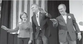  ?? AGENCE FRANCE PRESSE ?? Former US President George W. Bush waves with his wife Laura as he stands with his brother and Republican presidenti­al candidate Jeb Bush during a campaign rally in Charleston, South Carolina.