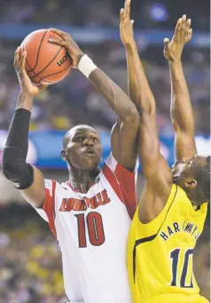  ?? ROBERT DEUTSCH, USA TODAY SPORTS Louisville coach Rick Pitino has found success by building teams with veterans such as Gorgui Dieng, left, to go deep in the tournament. ??