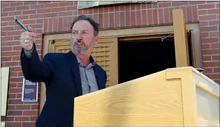  ?? NEWS FILE PHOTO ?? Mayor Ted Clugston points toward the South Saskatchew­an River from the vestibule outside city hall in this April 2020 file photo. Clugston will seek a third term this fall.