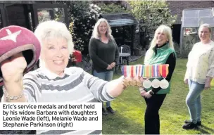  ??  ?? Eric’s service medals and beret held by his widow Barbara with daughters Leonie Wade (left), Melanie Wade and Stephanie Parkinson (right)