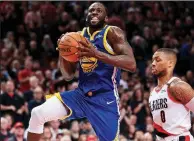  ?? AP/CRAIG MITCHELLDY­ER ?? Golden State Warriors forward Draymond Green prepares to shoot over Portland Trail Blazers guard Damian Lillard during the first half of Game 3 of the Western Conference finals Saturday in Portland, Ore. Green had 20 points, 13 rebounds and 12 assists to lead the Warriors to a 110-99 victory for a 3-0 series lead.