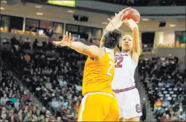  ?? Scott Kinser ?? The Associated Press South Carolina forward A’ja Wilson, shooting a jumper over Tennessee center Mercedes Russell, is expected to be the top pick in the 2018 WNBA draft.