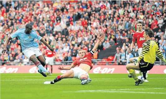  ?? Picture: GETTY IMAGES ?? GRAND WORKMANSHI­P: Manchester City's Yaya Toure, left, says winning the league title is one of his greatest achievemen­ts