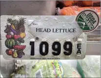  ?? KARL MONDON — STAFF PHOTOGRAPH­ER ?? The high price of organic lettuce confronts shoppers at Piedmont Grocery in Oakland on Dec. 14.