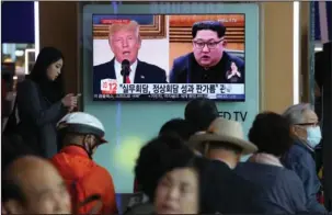  ?? The Associated Press ?? RULES OF ENGAGEMENT: People watch a TV screen showing images of U.S. President Donald Trump, left, and North Korean leader Kim Jong Un during a news program at the Seoul Railway Station in Seoul, South Korea, on Tuesday. A team of American diplomats...