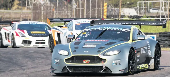  ?? Pictures: Paul Bedford ?? CLOSE. Charl Arangies (Stradale Aston Martin Vantage V12) and Lamborghin­i Gallardo drivers Simon Murray and Mark du Toit do battle in Saturday’s opening race for G&amp;H Transport Extreme Supercars at Zwartkops.