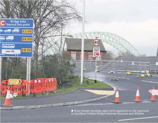  ??  ?? ● Road charge warning signs have appeared on the approach to the Silver Jubilee Bridge between Runcorn and Widnes