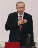  ?? (Umit Bektas/Reuters) ?? TURKEY’S PRESIDENT Recep Tayyip Erdogan greets members of the parliament and guests yesterday as he arrives to take his oath after his election win in Ankara.